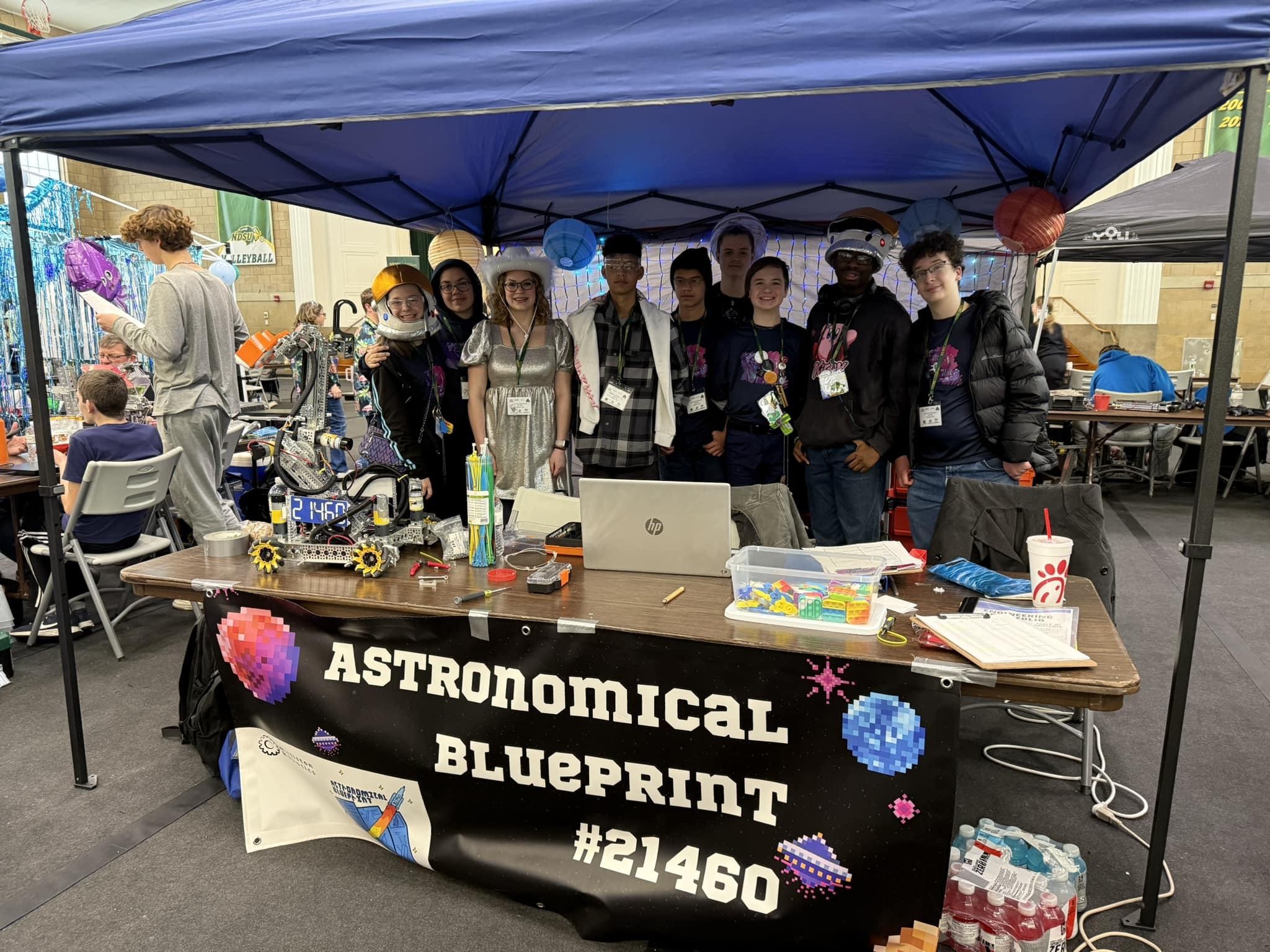 Williston Robotics FIRST Tech Challenge team "Astronomical Blueprint #21460" at their pit during a competition.